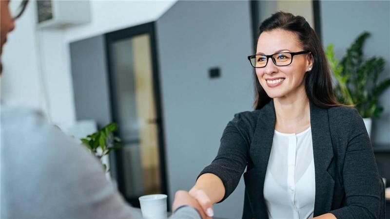 Job interview between candidate and recruiter in a professional setting